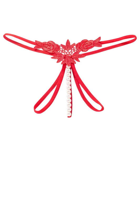 Red lace thong with floral design and pearl accents on a white background