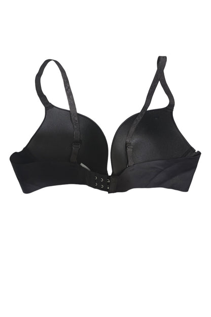 A black seamless underwire bra with adjustable shoulder straps and a central hook-and-eye closure, shown against a plain white background.