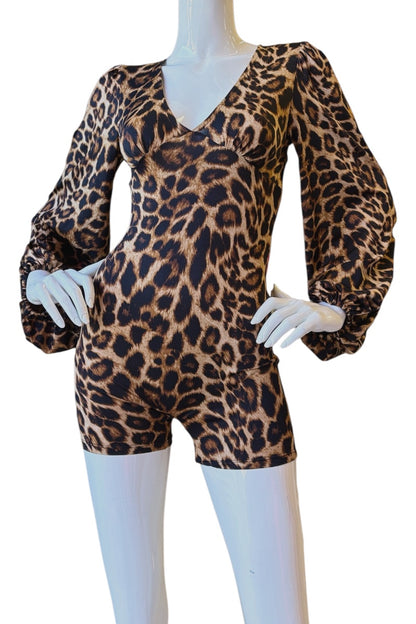 A leopard-print short romper displayed on a white mannequin with long puff sleeves and a V-neckline, photographed against a plain white background.
