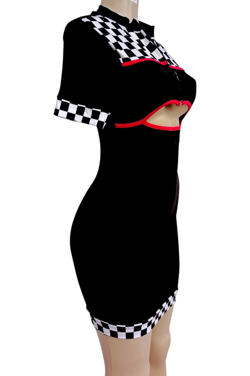 A black short-sleeve mini dress with a high collar, featuring a chest cutout outlined in red, a black and white checkered pattern on the shoulders and sleeve cuffs, and a matching checkered band around the hem, displayed on a mannequin against a white background.