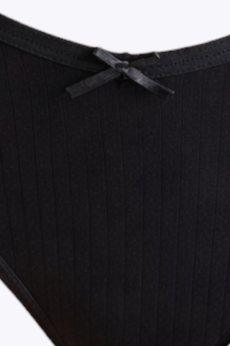 Close-up of black underwear with a white background