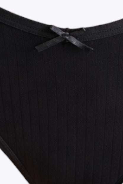 Close-up of black underwear with a white background
