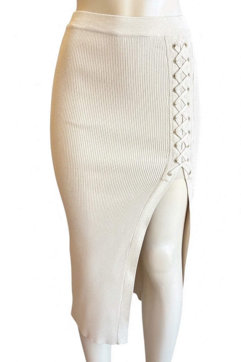 Beige ribbed pencil skirt with a front slit on a mannequin against a white background
