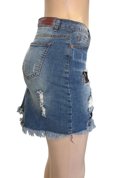 Denim skirt with distressed details on a mannequin against a white background