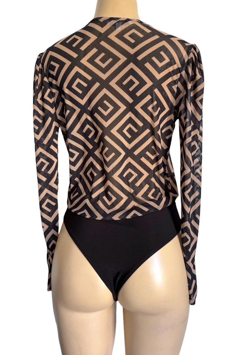 Mannequin wearing a black and beige patterned long-sleeve bodysuit on a white background