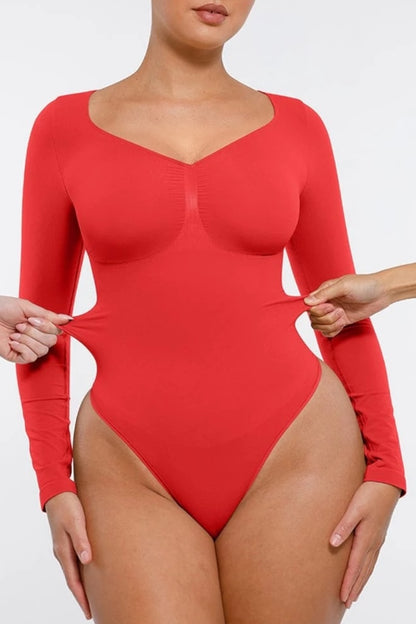 Red bodysuit with long sleeves being modeled on a white background