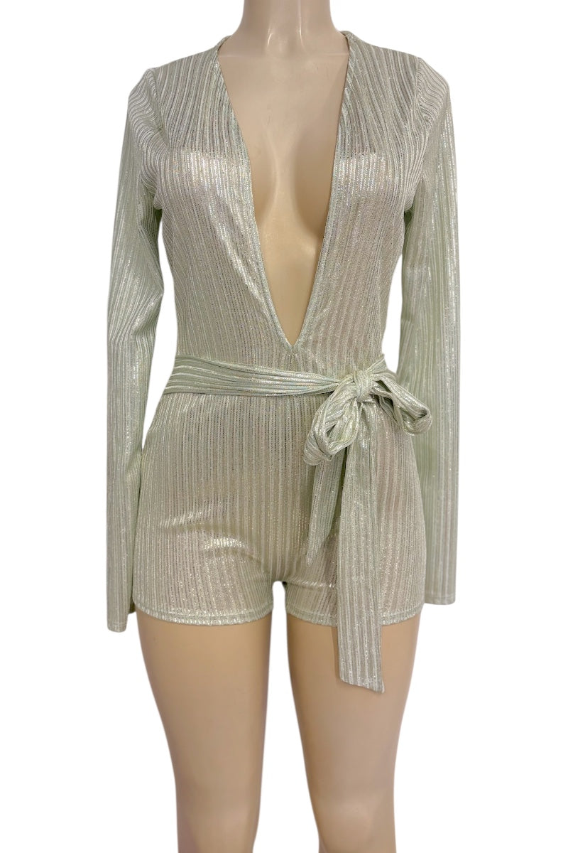 A shimmering metallic long-sleeve romper with a deep V-neckline, vertical textured stripes, and a matching waist tie, displayed on a mannequin against a white background.