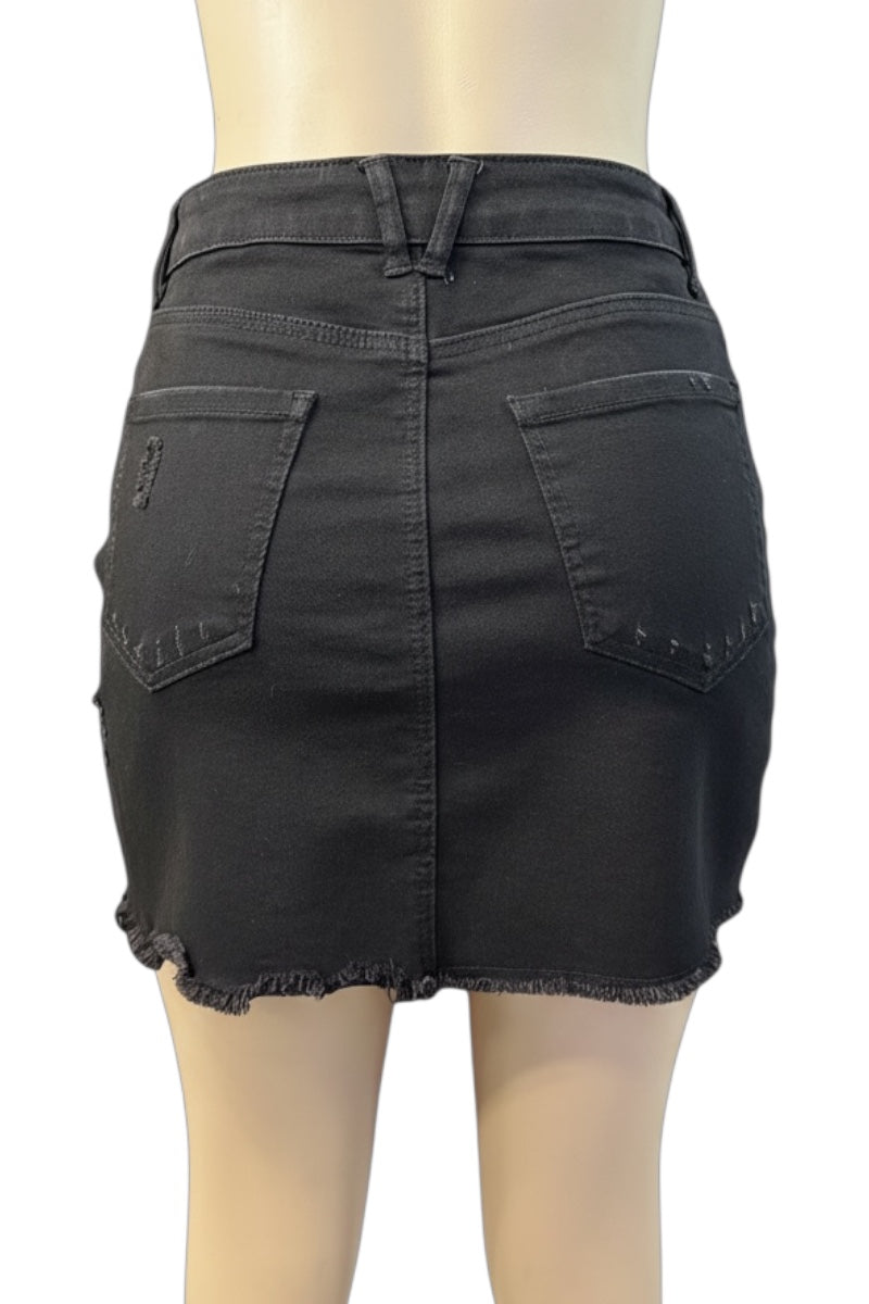 Black denim skirt on a mannequin against a white background