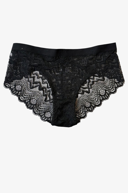 Black lace underwear with intricate patterns on a white background