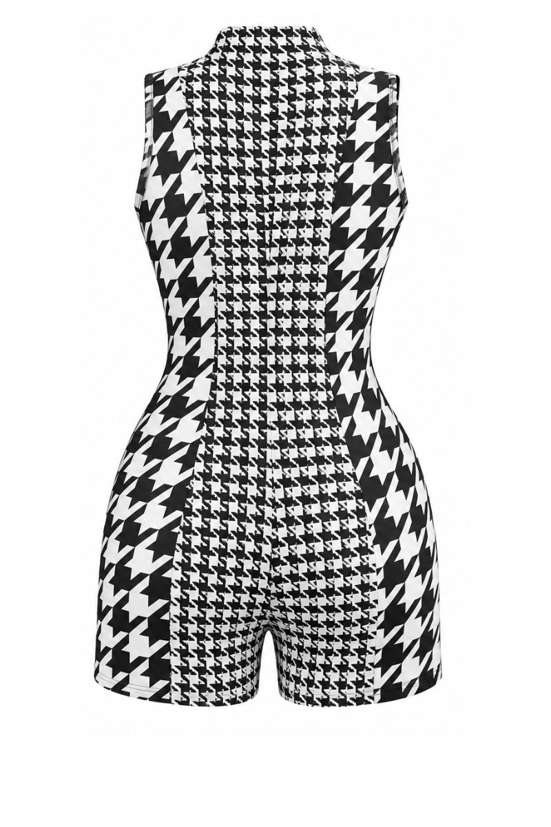 A sleeveless black and white houndstooth romper with a mock neck and shorts, shown from the back on a plain white background.
