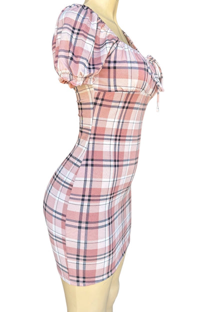 Plaid dress on a mannequin against a white background