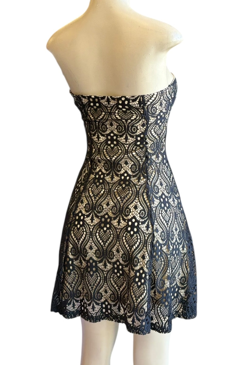 Lace dress on a mannequin against a white background