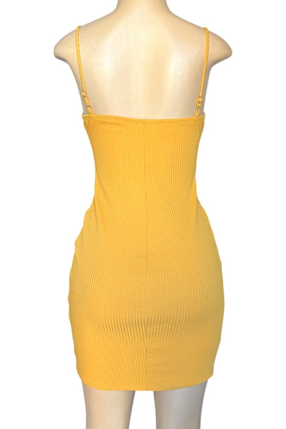Yellow ribbed dress on a mannequin against a white background