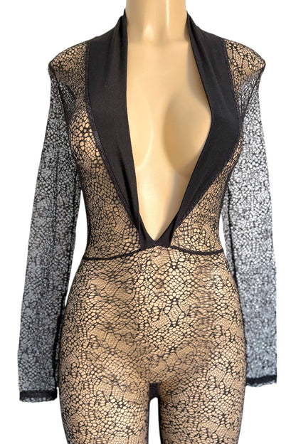 Mannequin wearing a black jumpsuit with long sleeves on a white background