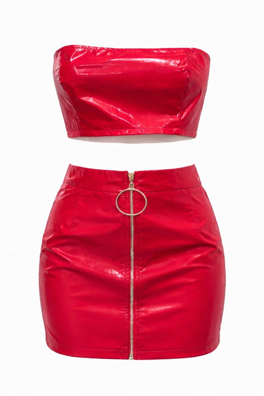 Red vinyl two-piece outfit with a top and skirt on a white background