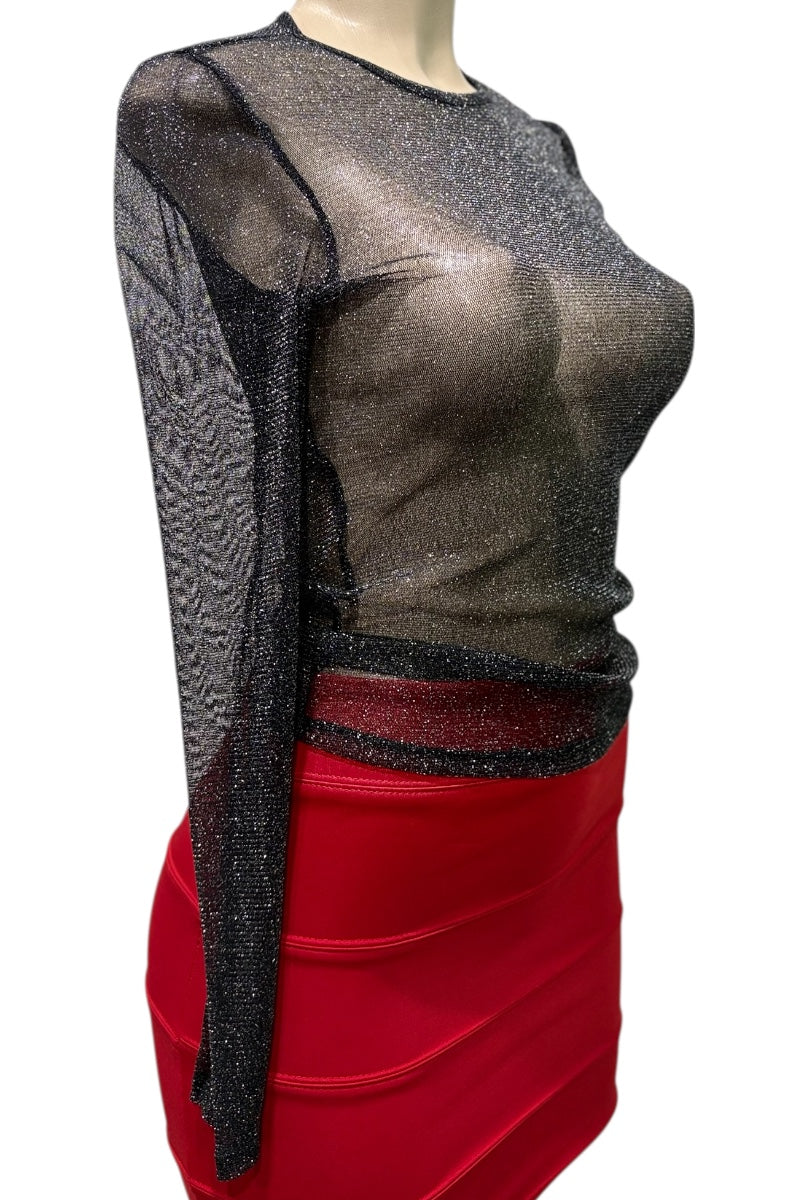 Mannequin wearing a sheer black top with long sleeves and a red skirt on a white background