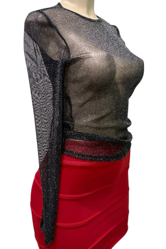 Mannequin wearing a sheer black top with long sleeves and a red skirt on a white background
