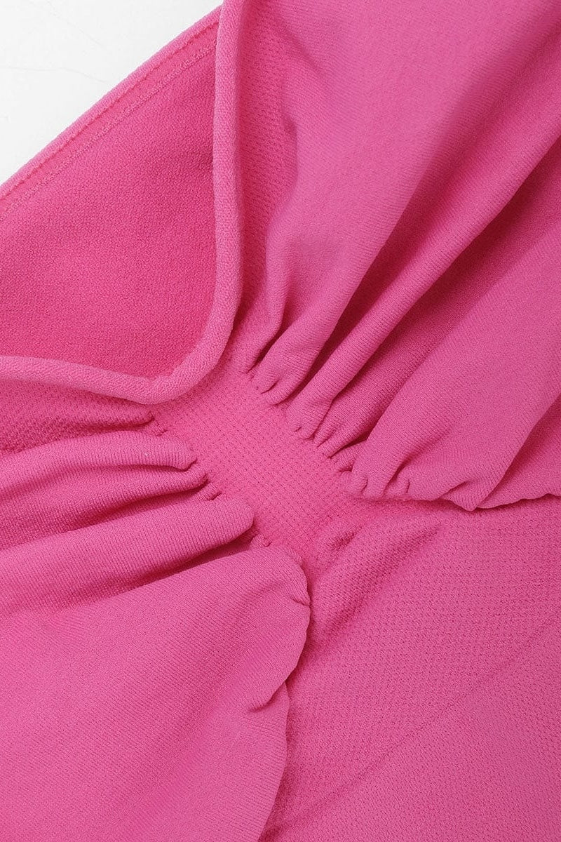 Close-up of a pink fuchsia fabric with ruffled details