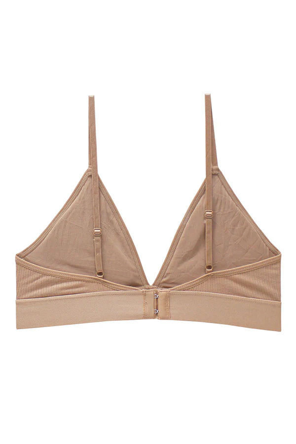 Beige bralette with thin straps on a white background