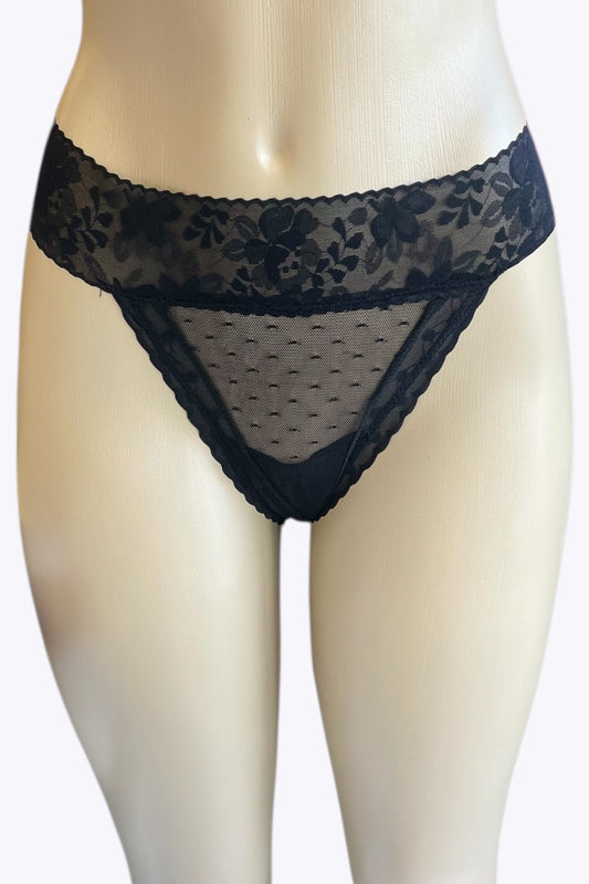 Black lace thong on a mannequin against a white background