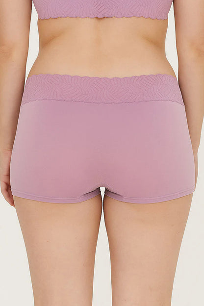 Person wearing pink Mauve shorts on a plain background