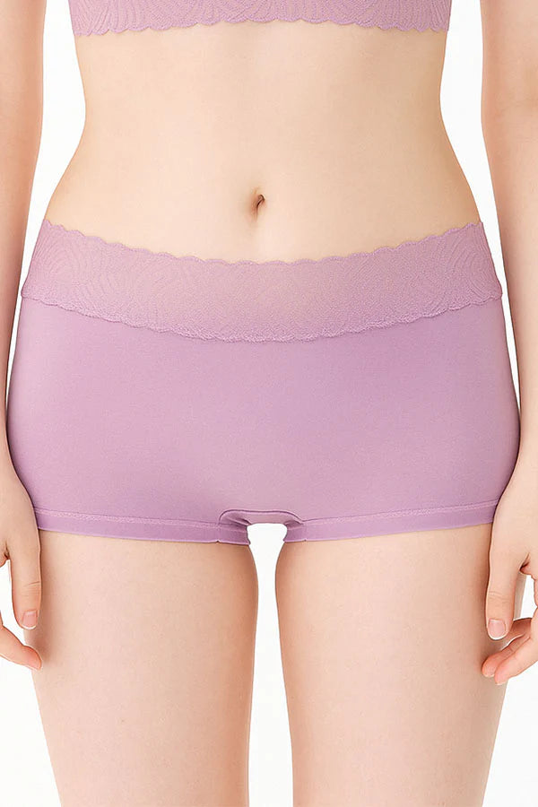 Person wearing a pair of Mauve underwear on a plain background