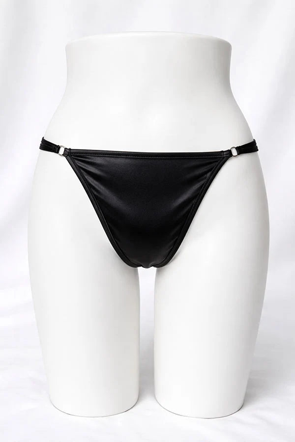 Black thong on a mannequin against a white background