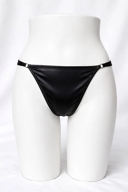 Black thong on a mannequin against a white background