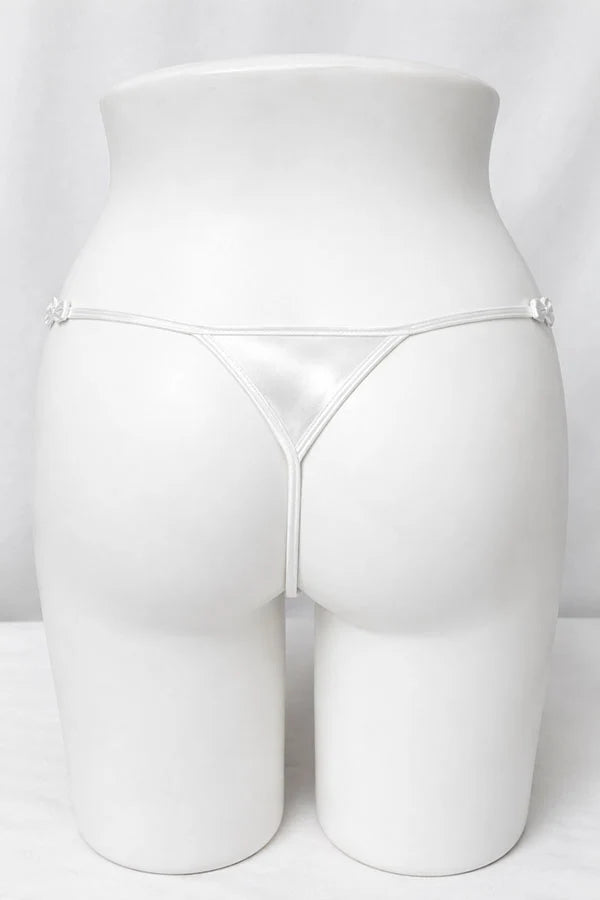 White satin thong underwear shown from the back on a white female mannequin torso, against a white studio background.