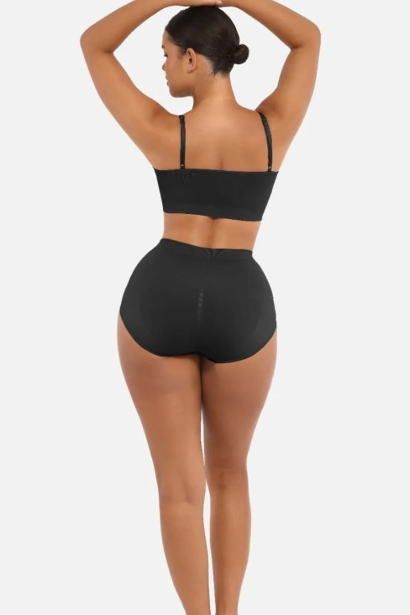 Person wearing a black set on a white background
