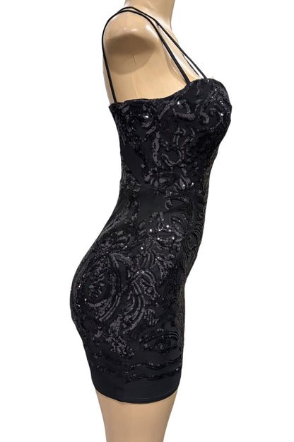 Black sequin dress on a mannequin against a white background