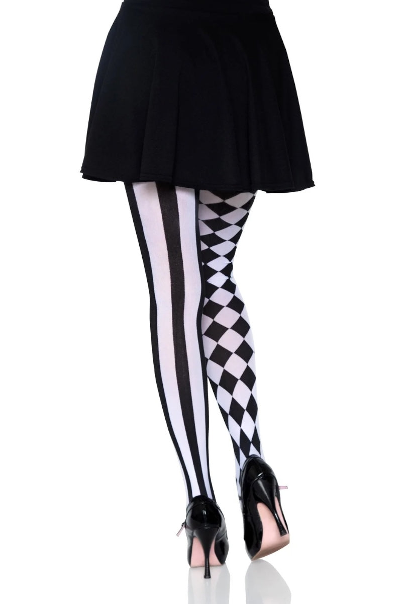 Black and white patterned tights worn with a black pleated mini skirt and black high heels, shown from the waist down on a white background.