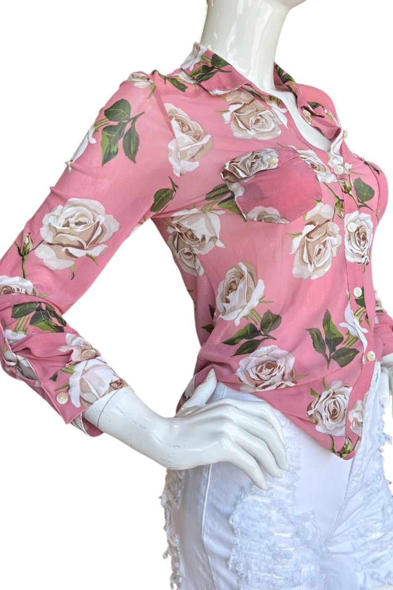 Mannequin wearing a pink floral long-sleeve top on a white background