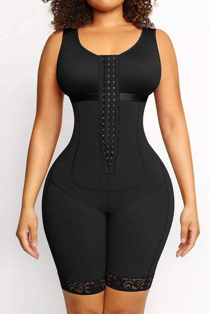 Black waist trainer worn by a model on a white background