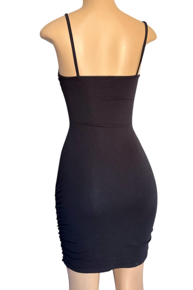 Black dress on a mannequin with a white background