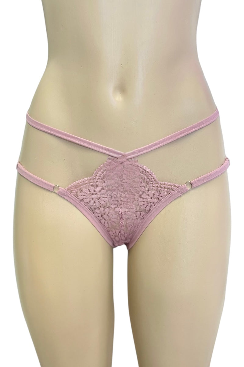 Pink lace thong on a mannequin against a white background