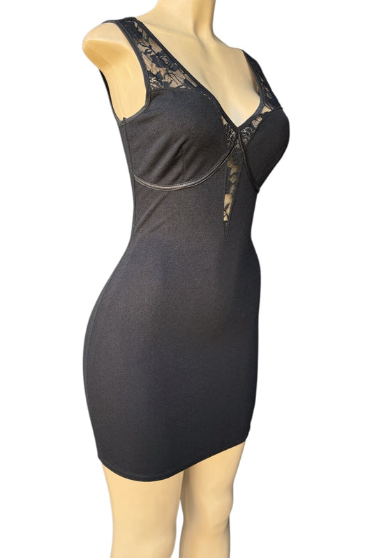 Black dress with lace details on a mannequin against a white background