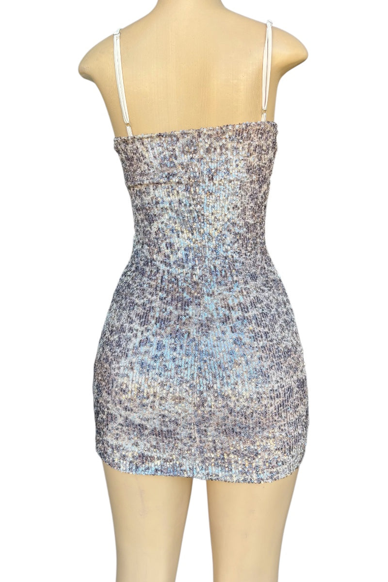Sequin patterned dress on a mannequin against a white background