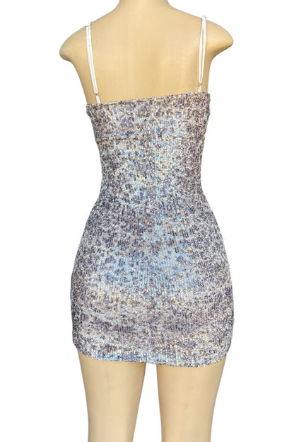 Sequin patterned dress on a mannequin against a white background