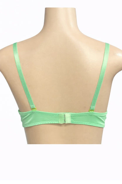 Green bra on a mannequin with a white background