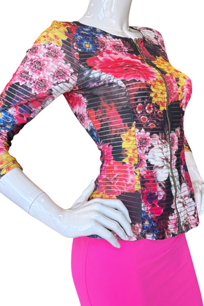 Colorful floral-patterned top on a mannequin with a white background