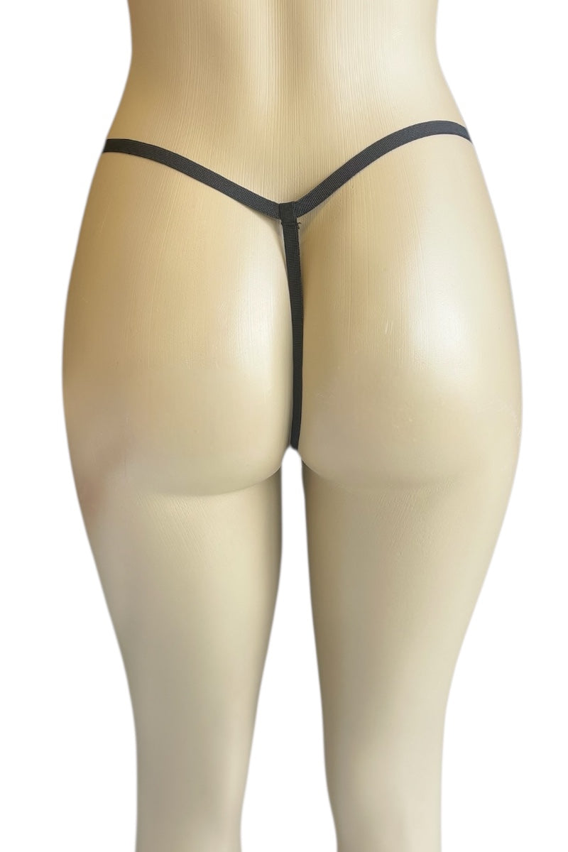 Black thong on a mannequin against a white background