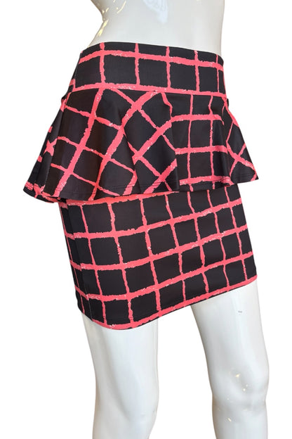 A black  mini skirt with a red grid pattern, displayed on a white mannequin against a white background.