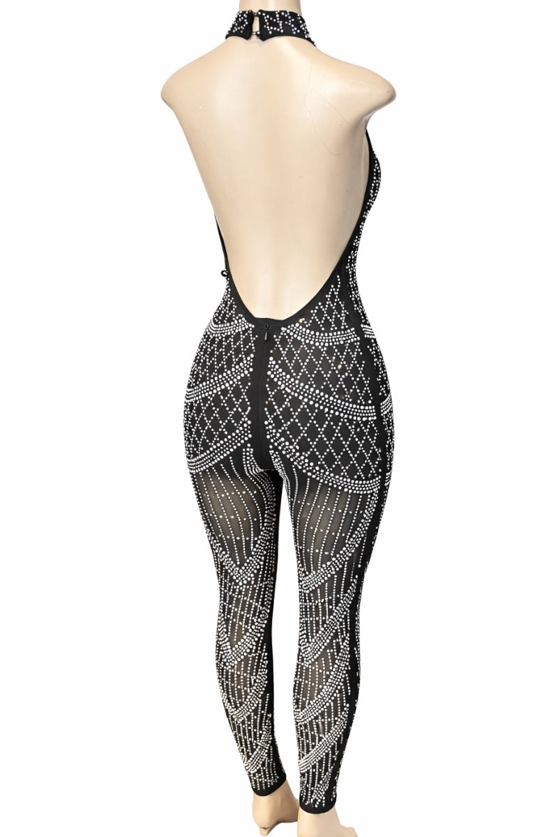 Black patterned jumpsuit on a mannequin against a white background