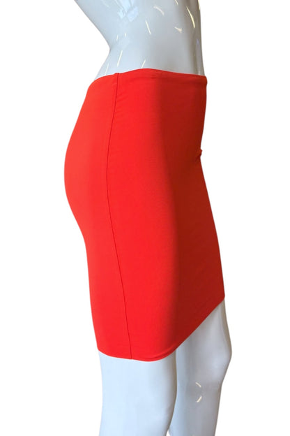 orange skirt on a white mannequin against a white background
