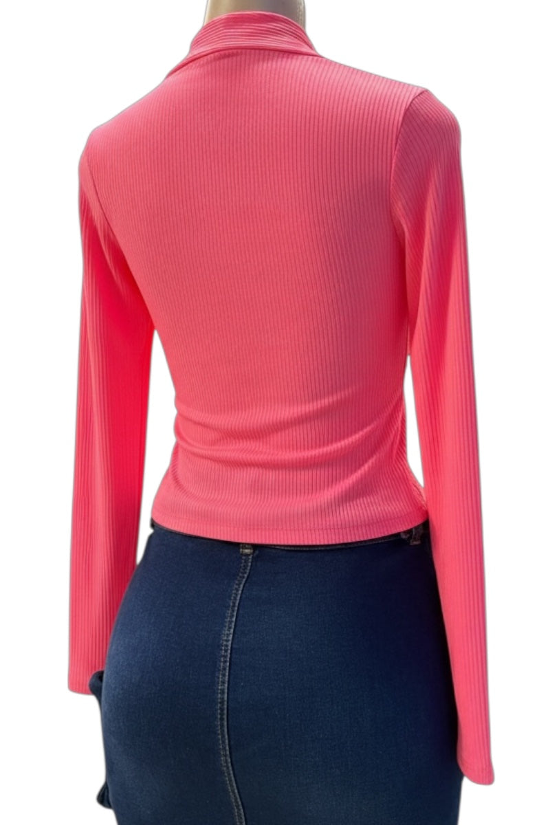 Pink ribbed long-sleeve top worn by a person on a white background
