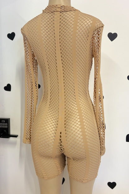 A beige fishnet long-sleeve bodysuit with a high neck and short legs, displayed on a mannequin from the back against a white wall with black heart decorations.