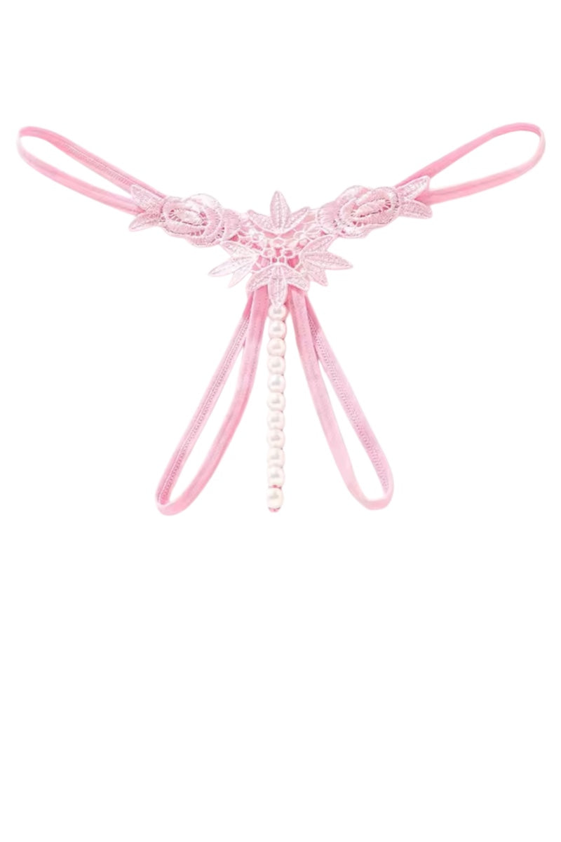 A light pink lace thong with a central floral applique and hanging pearl bead strands, shown on a plain white background.