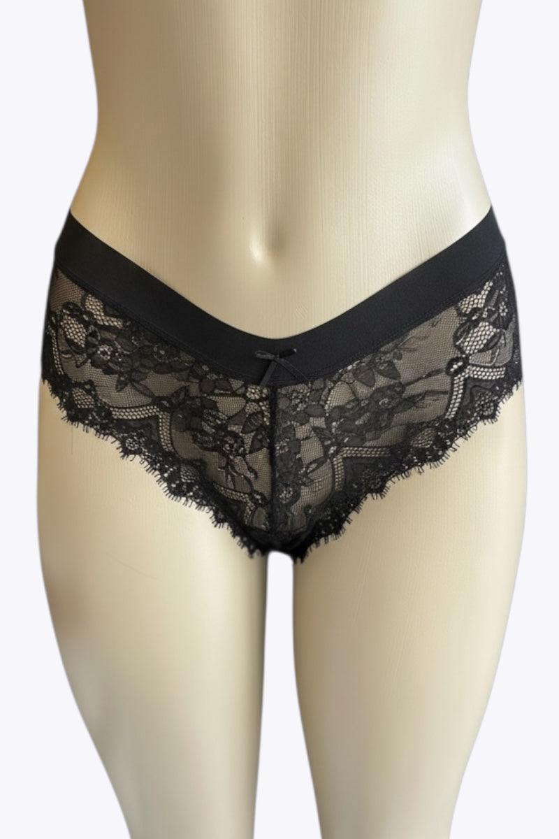 Black lace underwear on a mannequin against a white background