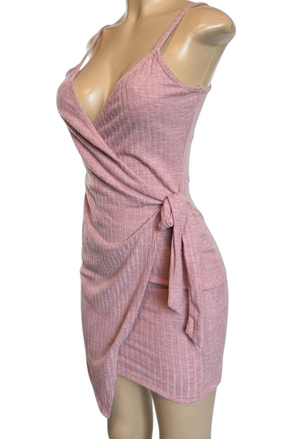 Pink textured dress on a mannequin against a white background